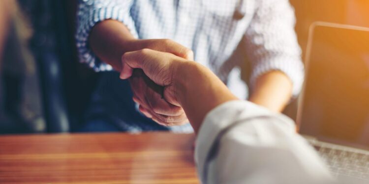 Business People Handshake Greeting Deal at work.